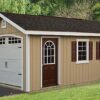 A-Frame shed with brown siding and overhead door