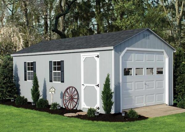 A-Frame shed with gray siding and overhead door