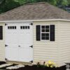 Hip-roof style shed with vinyl siding.