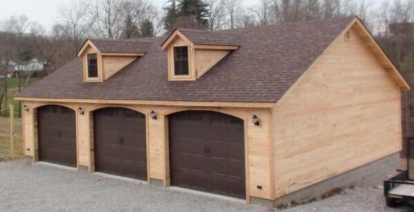 Three car garage with wood siding