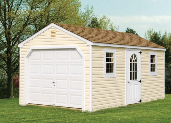 A-Frame shed with tan siding, white trim and overhead door