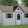 Tan Cape Cod Shed with reverse gable over door