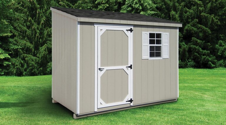 A Lean-To shed with wood siding painted gray