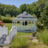 12' x 16' oval colonial style white vinyl gazebo with victorian braces, pagoda roof and cupola