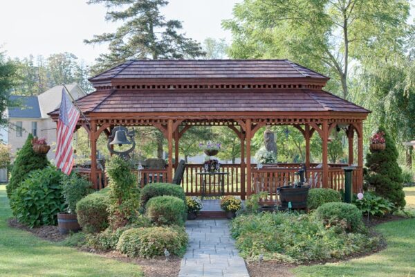 12' x 24' oval New England style wood gazebo with pagoda roof, cedar shakes and canyon brown stain