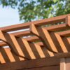 Details of a Santa Fe Pergola in pine on a paver patio