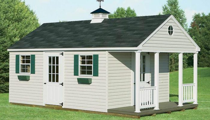 Tan Cape Cod Shed with porch